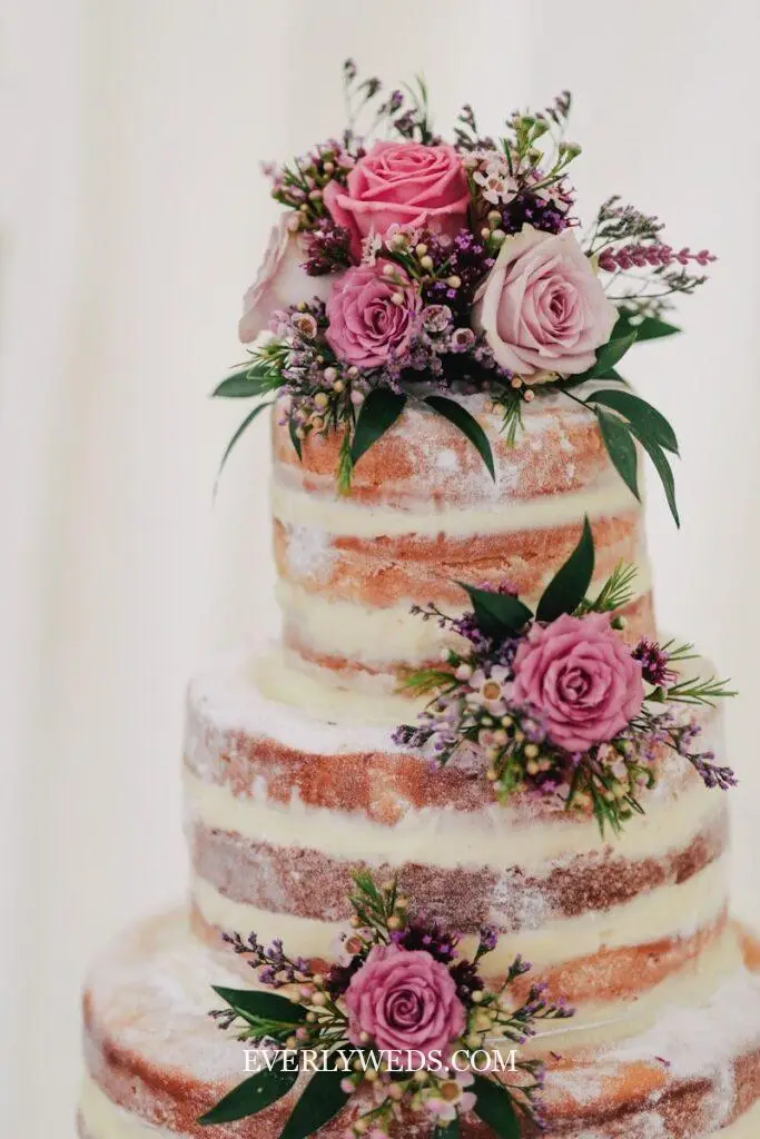 classic naked wedding cake design with fresh flowers and simple two-tier rustic style