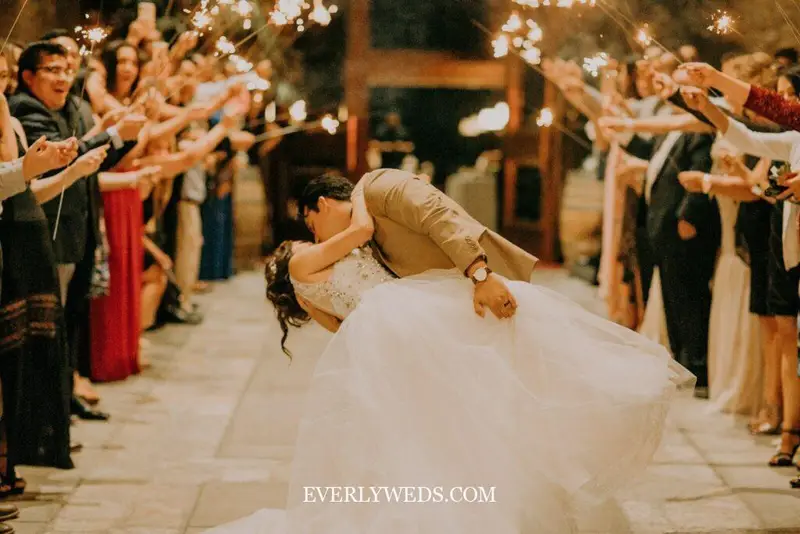 String quartet playing wedding ceremony exit songs as couple walks back down aisle at elegant wedding