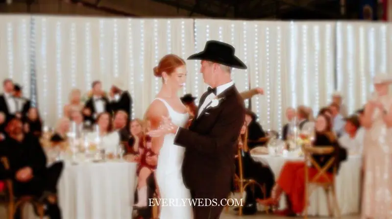 Modern bride dancing with father to contemporary wedding song at reception 2026