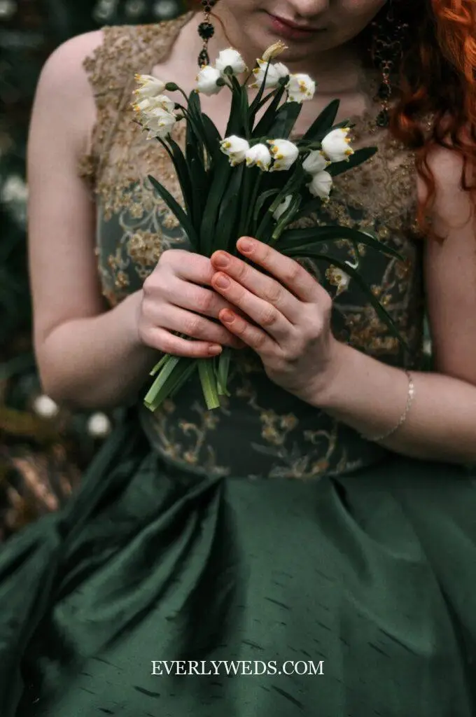 Green wedding theme planning tips showing cohesive sage green color palette across invitations, bridesmaid dresses, florals, and table settings to avoid color mismatch mistakes