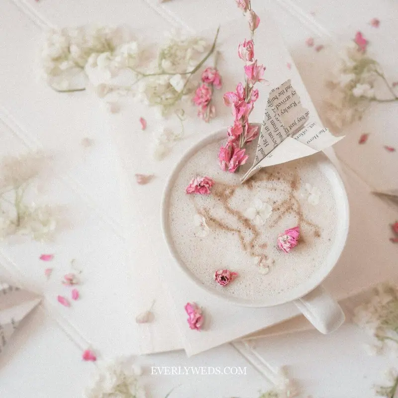 Creative floral save the date idea with heart latte art and pink flowers for unique wedding inspiration