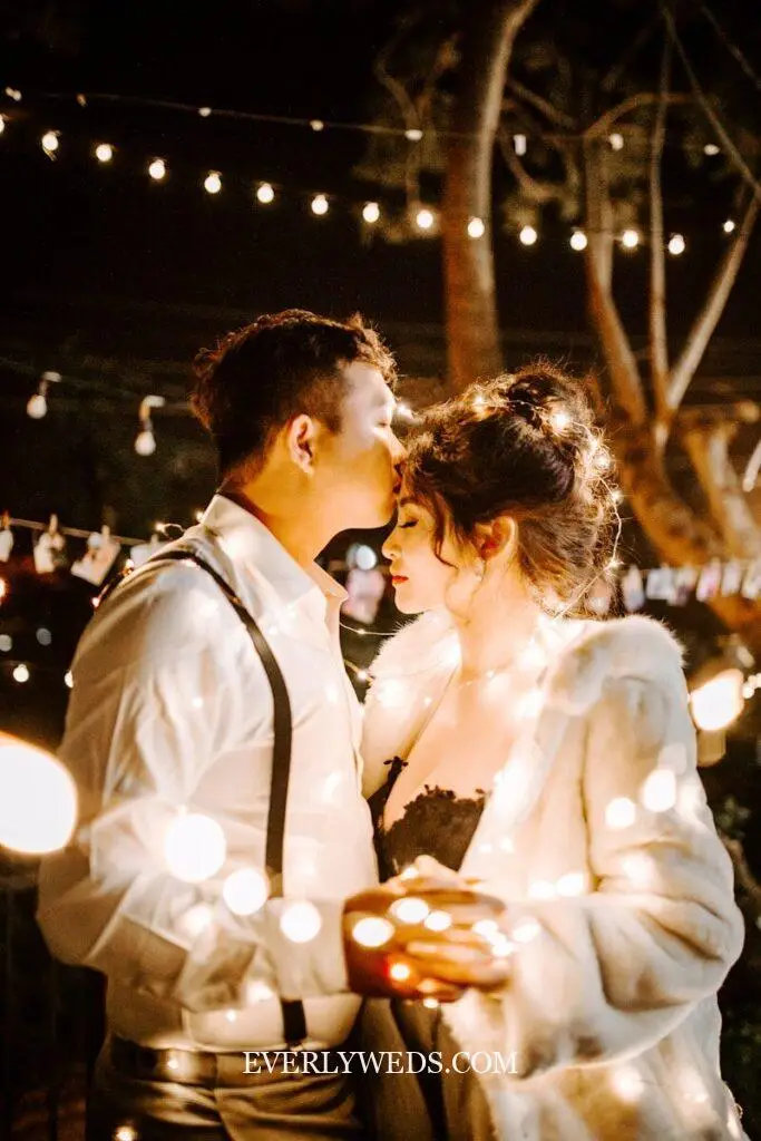 garden theme wedding reception with string lights twinkle lights dining under lights outdoor garden backyard wedding at night