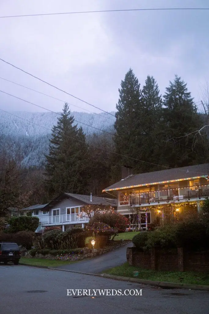 mountain lodge event venue spaces exterior with stone and wood architecture surrounded by pine trees wedding venue ideas