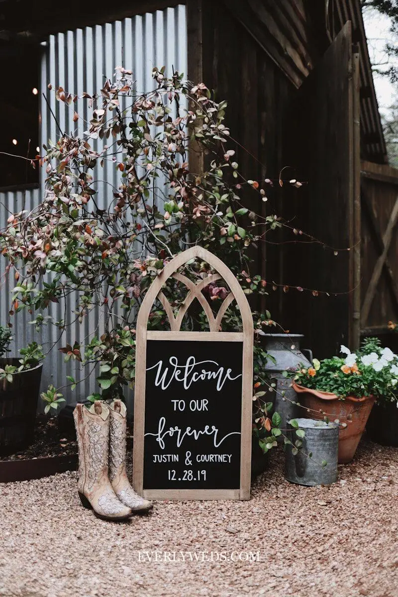 wedding set up ideas welcome wood sign with floral wreath at ceremony venue entrance cute wedding decor