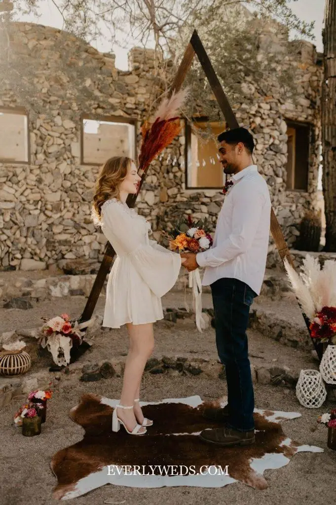 boho outdoor wedding event venue spaces with pampas grass arch earth tones and dried florals barn venue ideas