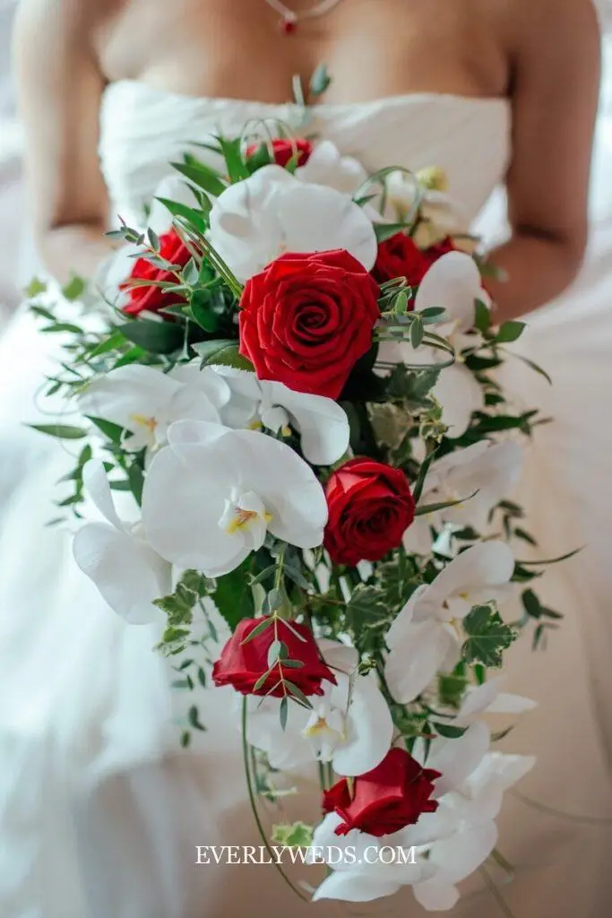 diy wedding bouquet fake flowers cascade style with trailing greenery and roses waterfall bouquet