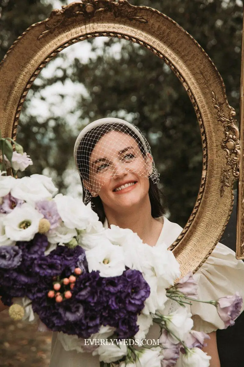 vintage frames and props used as wedding venue decorations at outdoor rustic reception, rustic modern wedding decor ideas