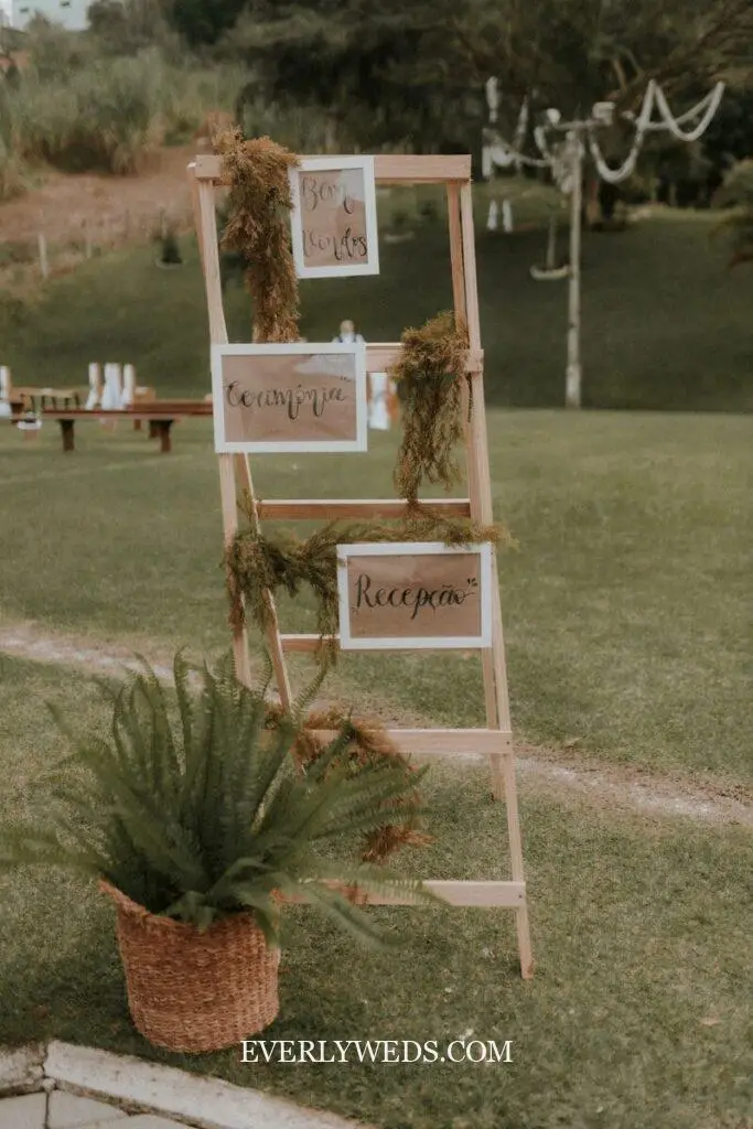 a sign that is on a wooden ladder