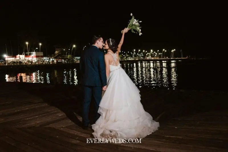 summer camp wedding event venue spaces outdoor lakeside setting with rustic wood dock and string lights party event venue spaces