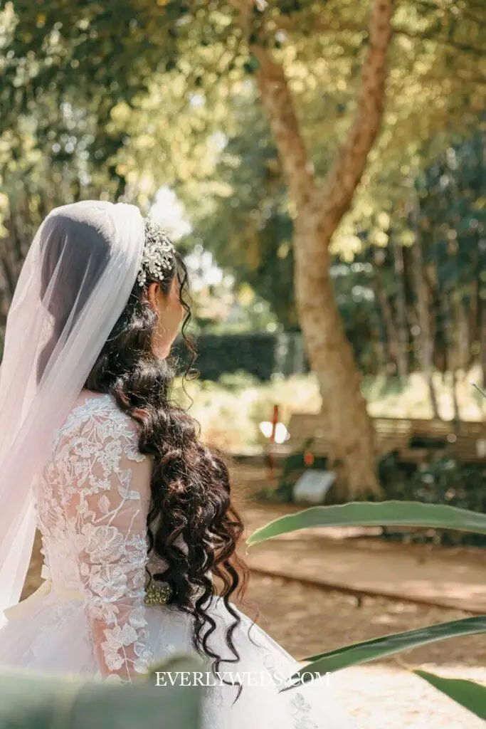 Bride in a white lace dress with a veil
