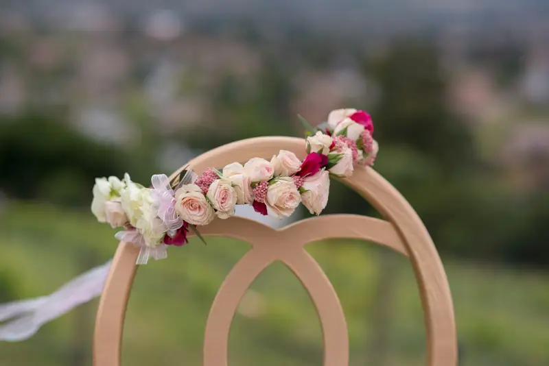 A wooden ring with flowers on top of it